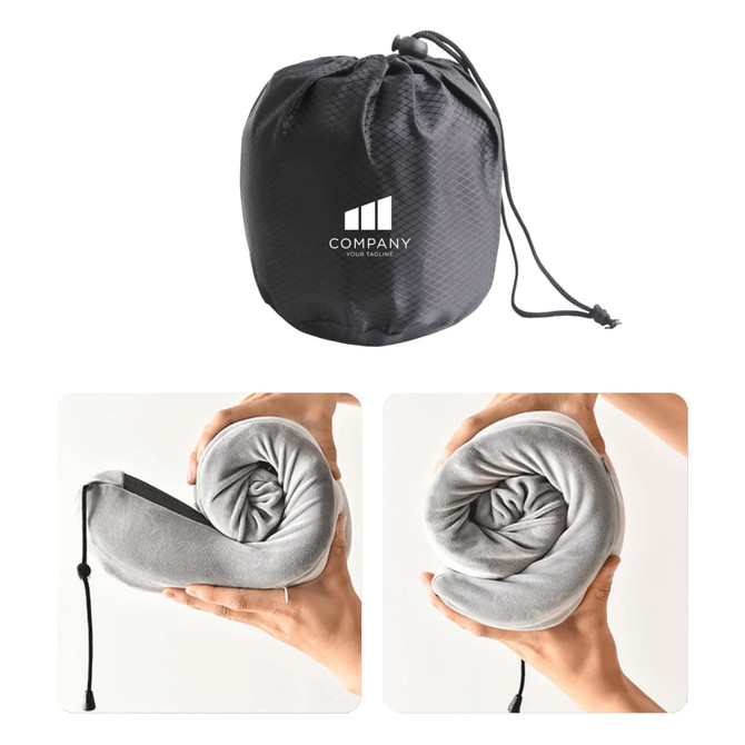 A grey memory foam U-shaped travel pillow rolled and stored in a black pouch with a logo.