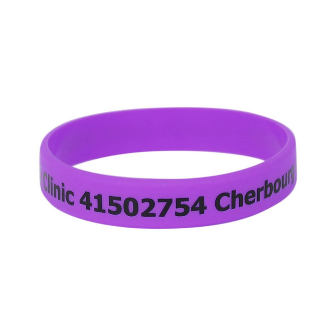 A purple silicone wristband featuring printed text and a logo.