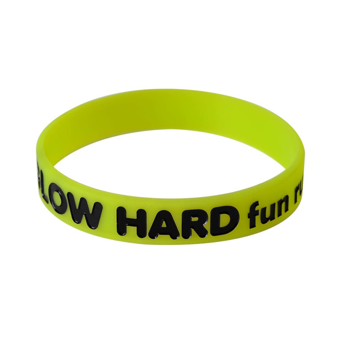 A bright yellow silicon wristband featuring black debossed text and a logo. Suitable for exhibitions and events.