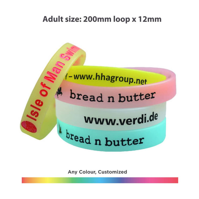 A set of silicone wristbands in pink, white, and blue with branding and customisable options. A set of silicone wristbands in pink, white, and blue with branding and customisable options.