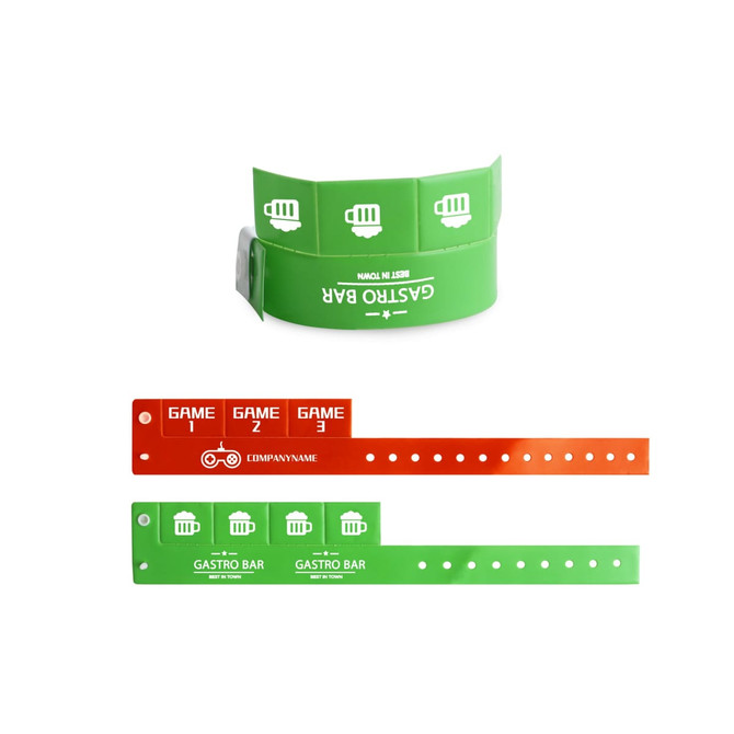 A green and orange tabbed disposable PVC wristband with circular cutouts and a logo, designed for events. A green and orange tabbed disposable PVC wristband with circular cutouts and a logo, designed for events.