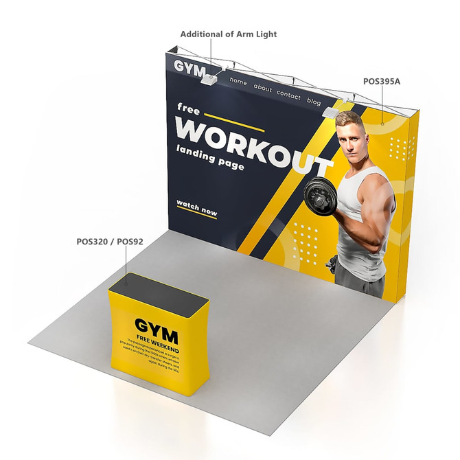 A large pop-up display wall in yellow and black, featuring a fitness model, with a counter in front.