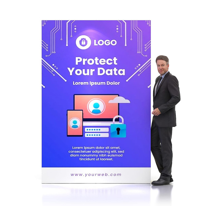 A man in a suit stands beside a purple and blue pop-up display wall with a logo and technology-themed graphics.