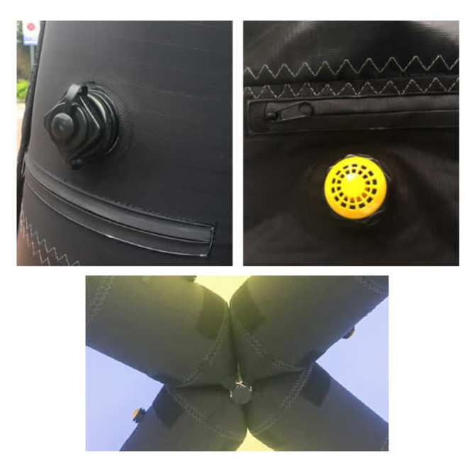 Close-up of a black inflatable marquee's inflation valve, with a yellow air release valve shown.