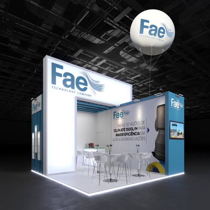 An inflatable advertising balloon in white and blue hovers above a modern exhibition stand with seating and promotional displays.