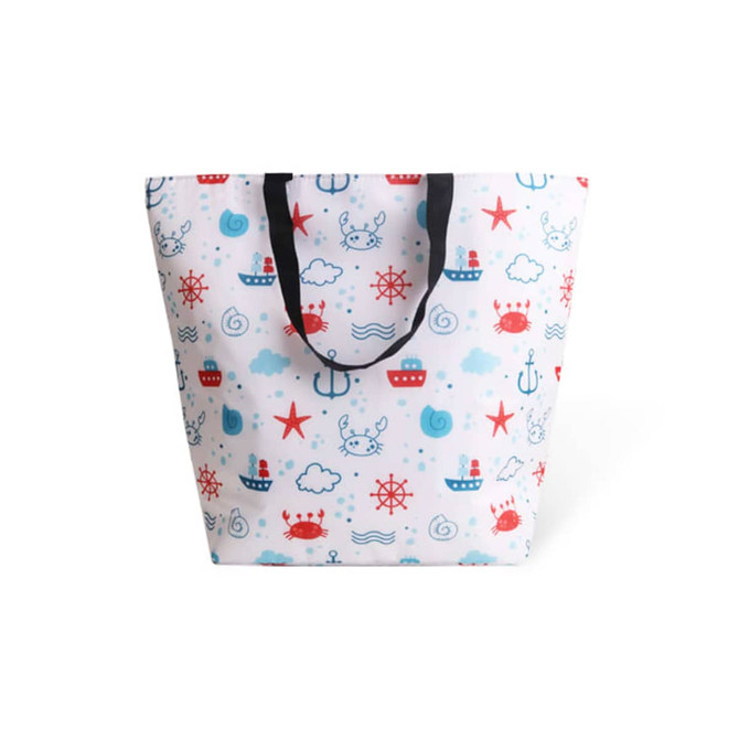 A large cooler tote bag in white, featuring a playful nautical pattern with red and blue elements, and black handles.