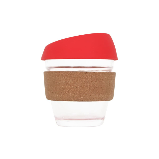 A reusable glass coffee cup with a red lid and cork band, featuring a transparent body.