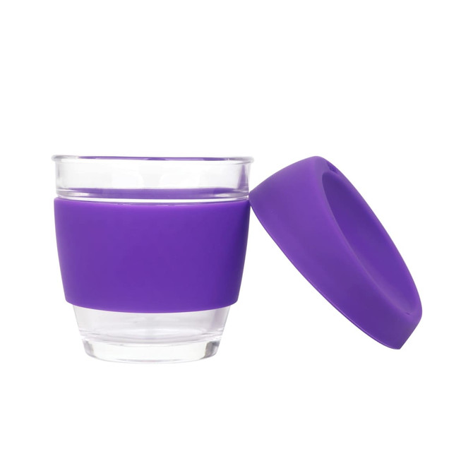 A reusable glass coffee cup with a purple silicone sleeve and matching lid. Features a clear glass body.