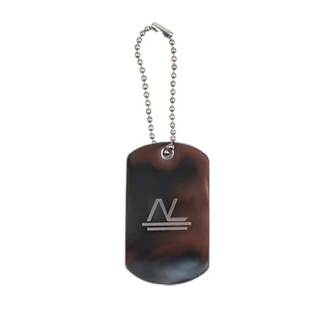 A metal dog tag on a ball chain, featuring a simple logo with a sleek, polished finish.
