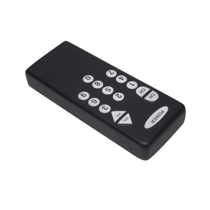 A black remote control-shaped stress reliever with white buttons and a logo on its surface.