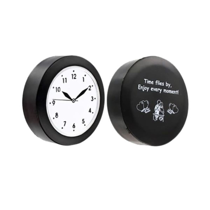 A black quart clock-shaped stress reliever featuring a white clock face and a motivational message on the reverse side.