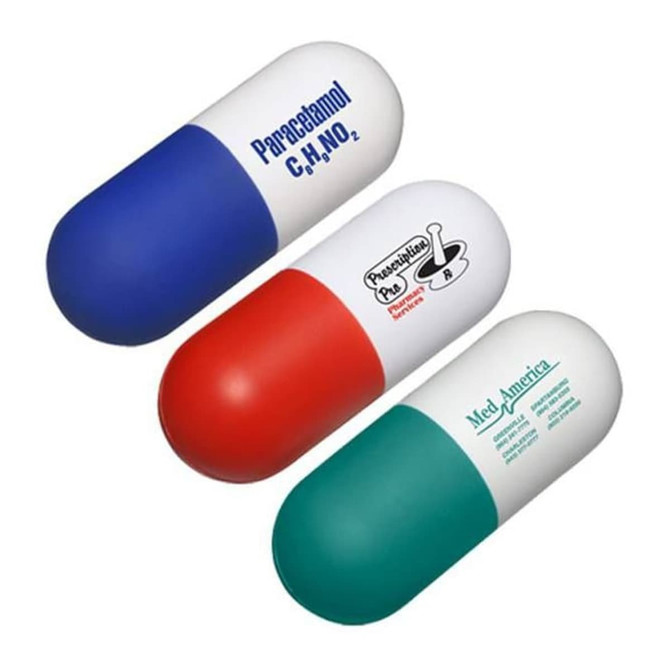 A capsule-shaped stress reliever in blue, red, and green, featuring a logo on the surface.