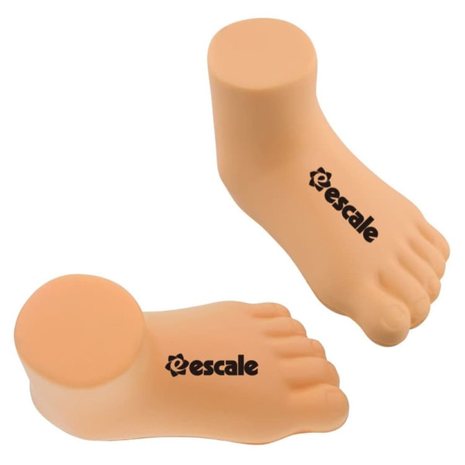 A pair of peach-coloured foot-shaped stress relievers with a logo on the side.