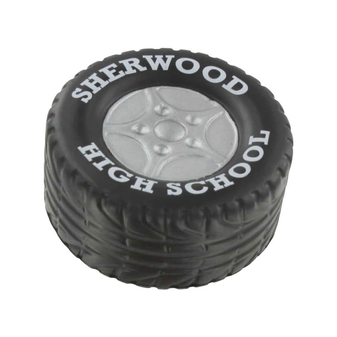 A black tire-shaped stress reliever with a grey wheel design and a logo on the side.