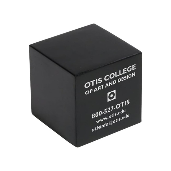 A black cube-shaped stress reliever with a logo and text on one side.