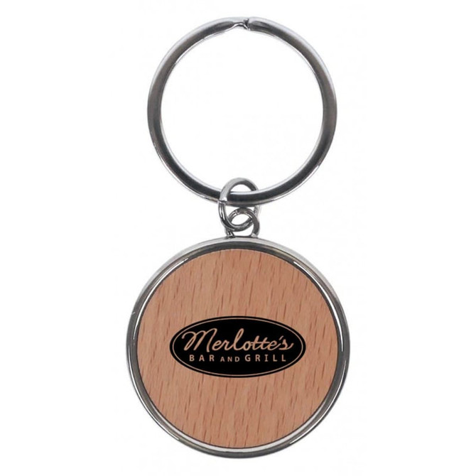 A round keychain featuring a wooden design and a logo on the front, attached to a metal ring.