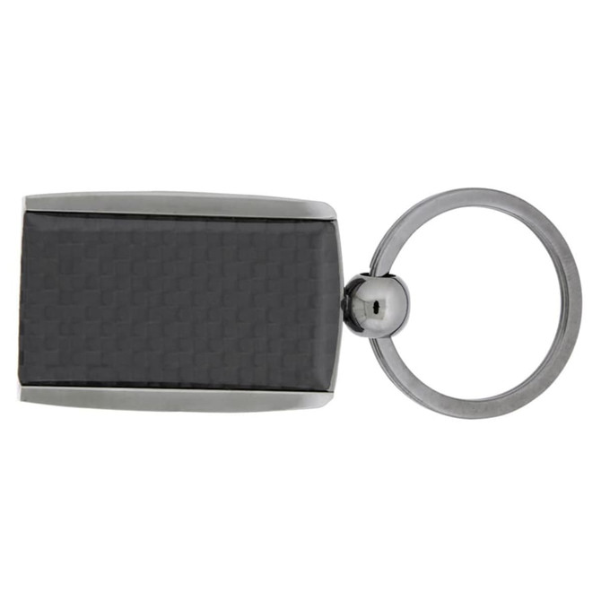 A carbon fibre keychain in black with a silver ring and a sleek design. It features a logo on one side.