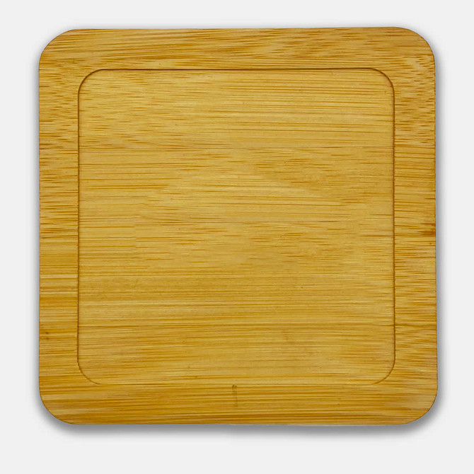 A bamboo coaster with a smooth, natural finish, featuring rounded edges and a recessed centre.