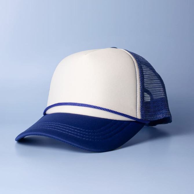 A trucker cap in cream and navy blue with a mesh back and a curved brim. It features a logo on the front.