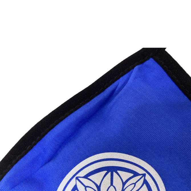 A blue cotton face mask with a black edge and a circular logo on the front.