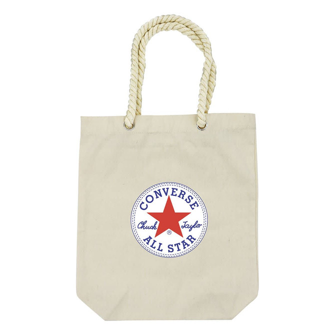 A cream tote bag with a round logo in blue and red, featuring a rope handle.