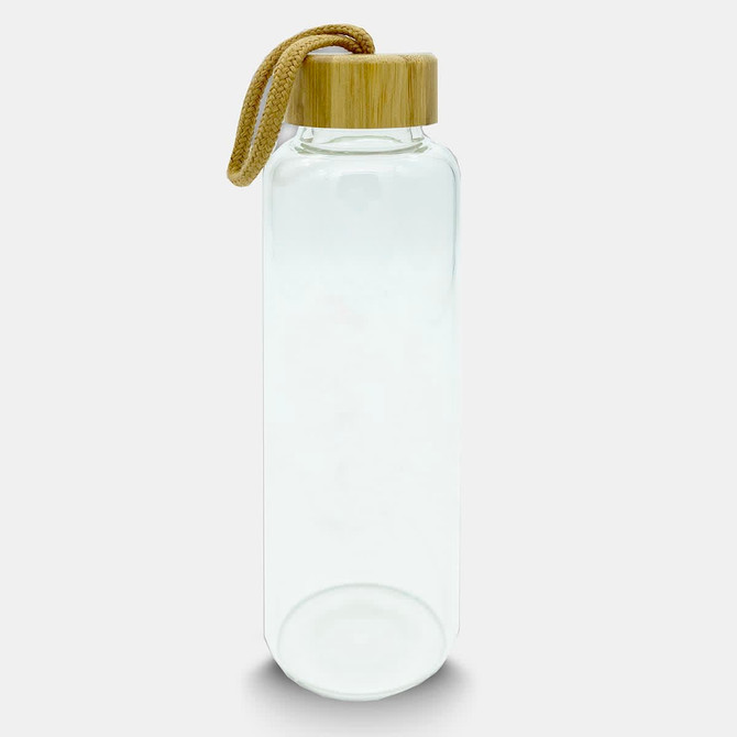 A drink bottle made of clear glass with a bamboo lid and a woven strap.