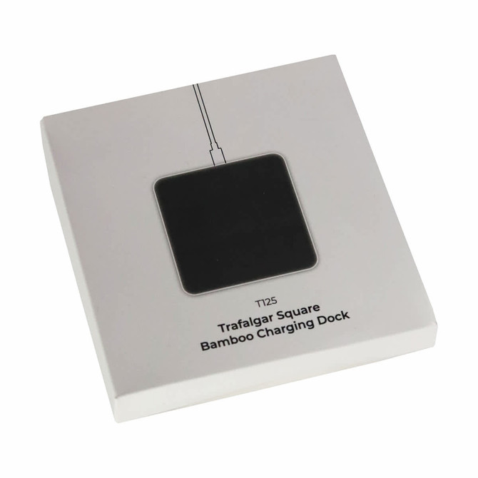 A square bamboo charging dock in a sleek white packaging with a black surface and logo. A square bamboo charging dock in a sleek white packaging with a black surface and logo.