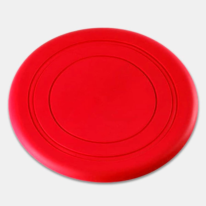 A red silicone frisbee with a smooth surface and circular design, featuring an embossed ring pattern.