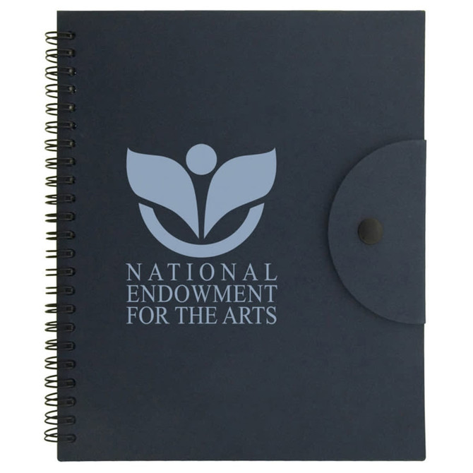 A navy spiral-bound notebook with a flap closure and a branding logo on the front cover.