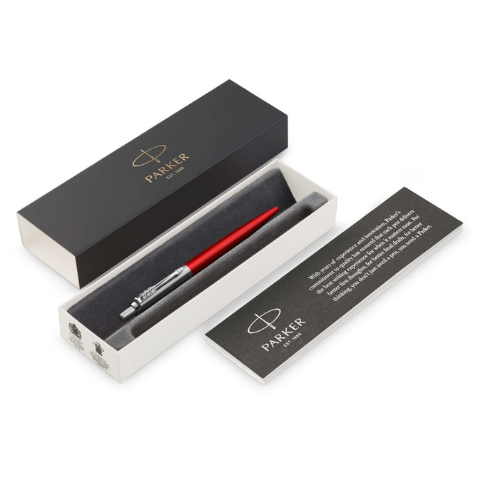 A ballpoint pen in Kensington red is displayed in a sleek black and white box with a logo.