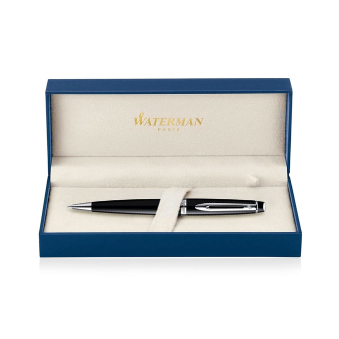 A black lacquer ballpoint pen displayed in a blue box with a soft interior. The box features a branding logo.