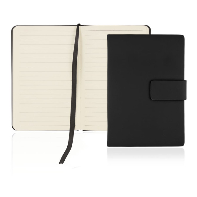 A black A6 notebook journal with a magnetic closure and a textured cover, featuring lined pages inside.