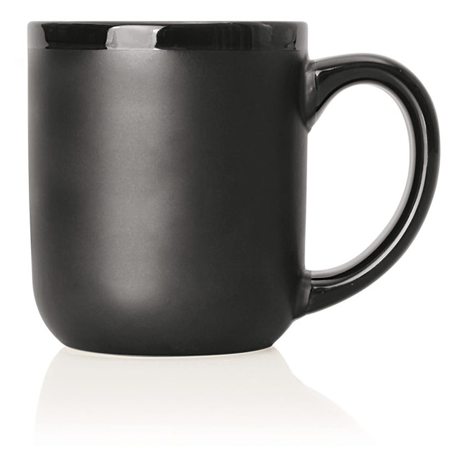 A ceramic mug in matte black with a glossy black trim, featuring a curved handle and a rounded body.