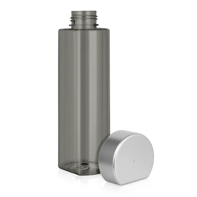 A drink bottle in grey Tritan material with a flat-side design and a silver lid beside it.