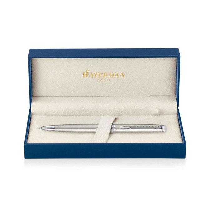 A brushed stainless ballpoint pen in a blue presentation box with a soft interior and branding visible.