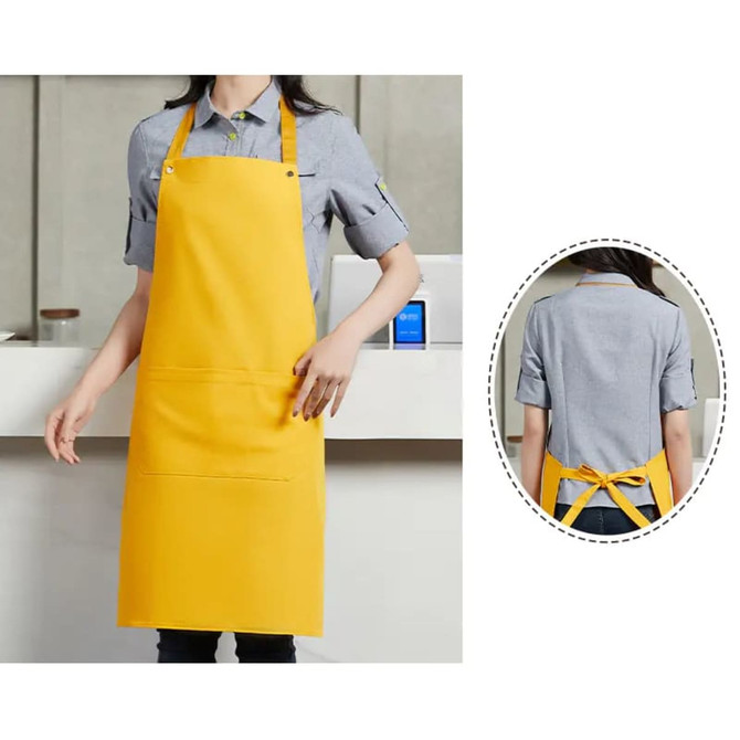 A yellow poly-cotton canvas bib apron with a colour neck strap and a front pocket. Features a logo on the back.