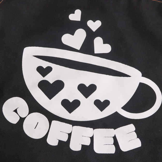 A black apron featuring a white coffee cup graphic with hearts and the word "COFFEE" in bold lettering.