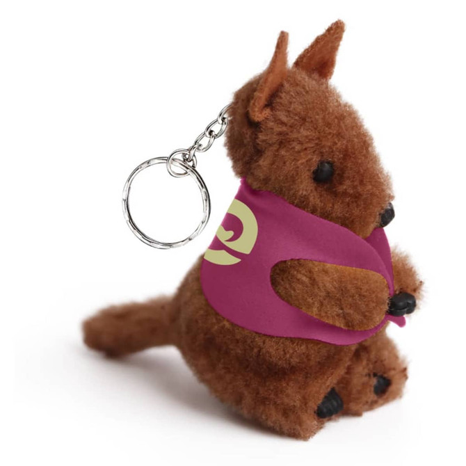 A brown kangaroo plush toy with a keychain attachment, wearing a purple cape. It features a branding logo.