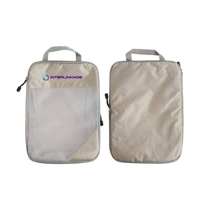 Two beige travel packing cubes with mesh sections and handles, featuring a logo on one side.