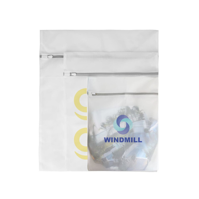 Three white mesh laundry bags of varying sizes, featuring a logo on one bag and zip closures.