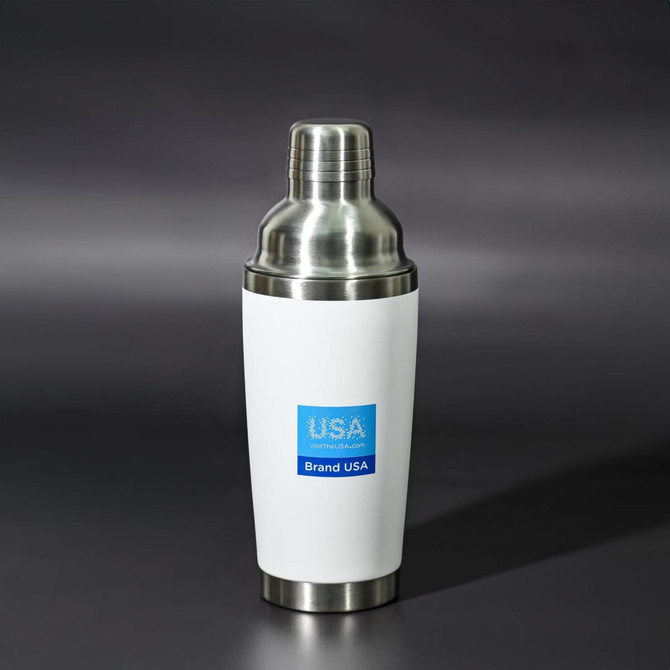 A drink bottle in white and stainless steel with a logo, featuring a shaker design.