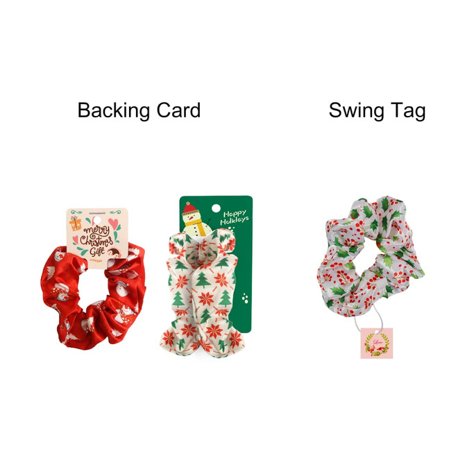 A set of three festive hair scrunchies in red and white with Christmas-themed patterns, displayed on a backing card.