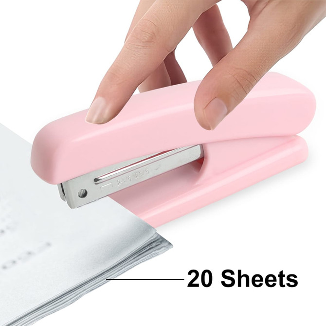 A pink stapler is being used to staple a stack of paper sheets together. It has a shiny metal staple compartment.