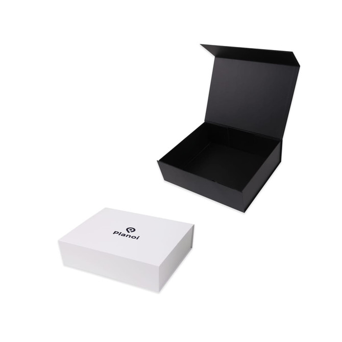 A black foldable magnetic box is partially open beside a white box with a logo. Both are designed for packaging. A black foldable magnetic box is partially open beside a white box with a logo. Both are designed for packaging.