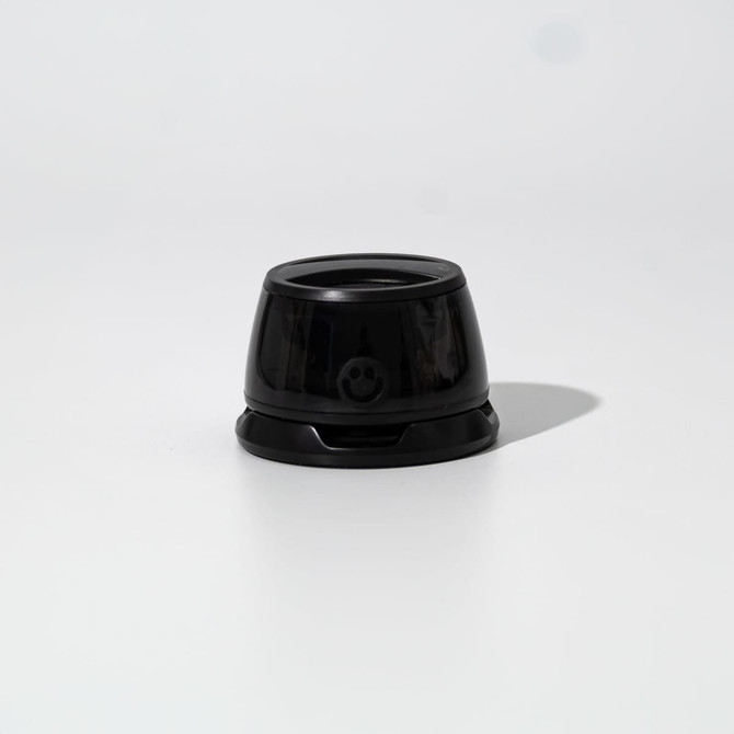 A black speaker with a rounded design, featuring a smooth surface and a small branding element at the front. A black speaker with a rounded design, featuring a smooth surface and a small branding element at the front.
