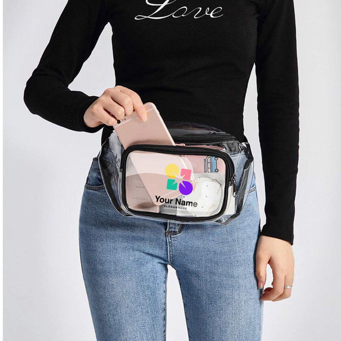 A clear fanny pack with a transparent front, featuring a phone, charging cable, and a logo. It has a black trim. A clear fanny pack with a transparent front, featuring a phone, charging cable, and a logo. It has a black trim.