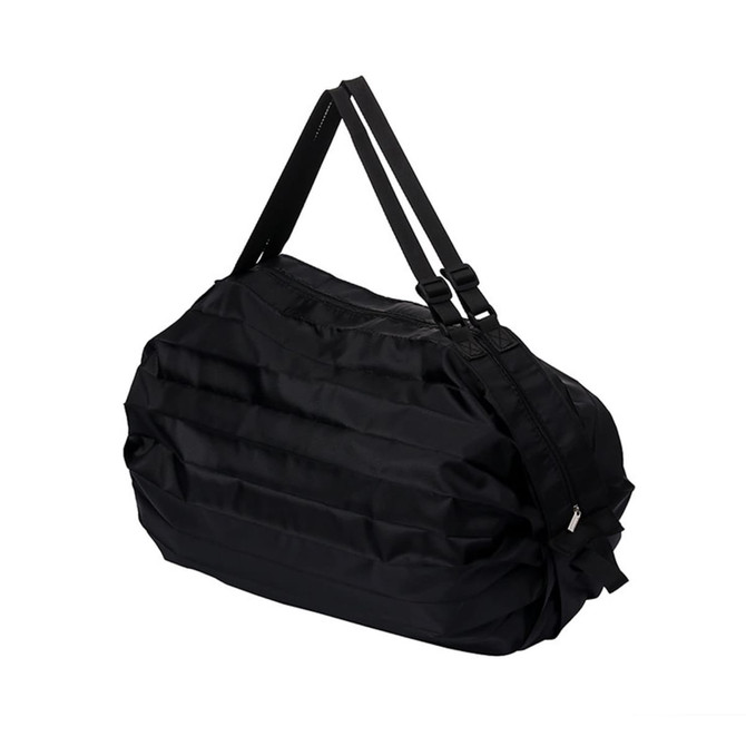 A foldable shoulder bag in black with adjustable straps and a zip closure. Features a textured surface.