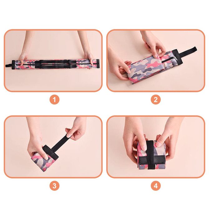 A foldable shopping shoulder bag in a camouflage pattern, being rolled and secured with a strap.