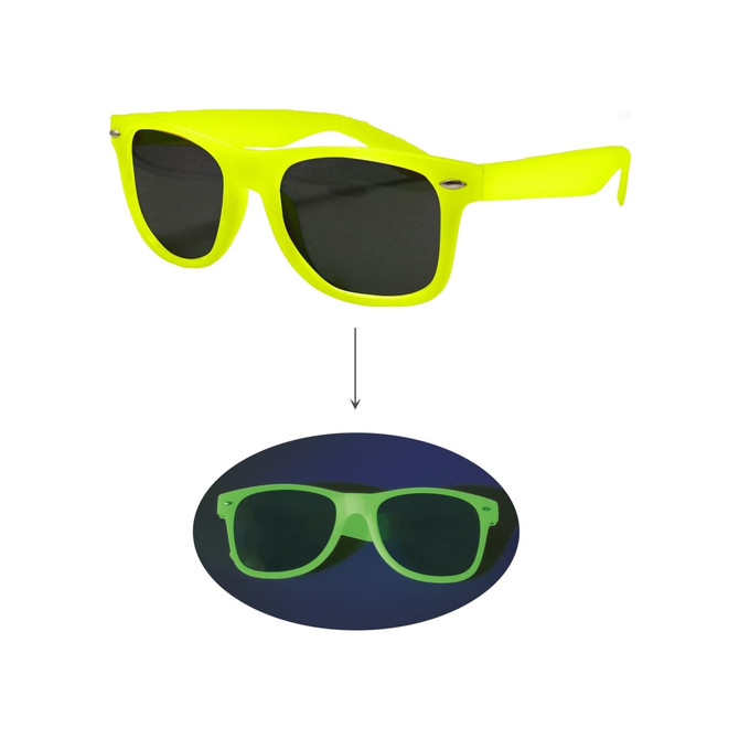 Glow in the dark sunglasses in bright yellow with dark lenses, displayed against a dark background. Features a logo.