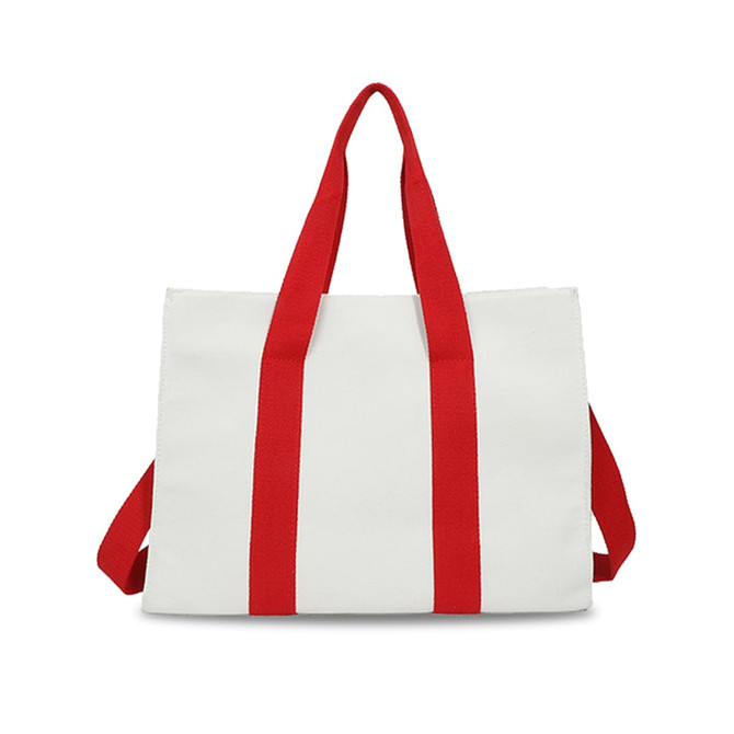 A white canvas grocery shopping bag with red straps and a simple design. It features a logo on one side.